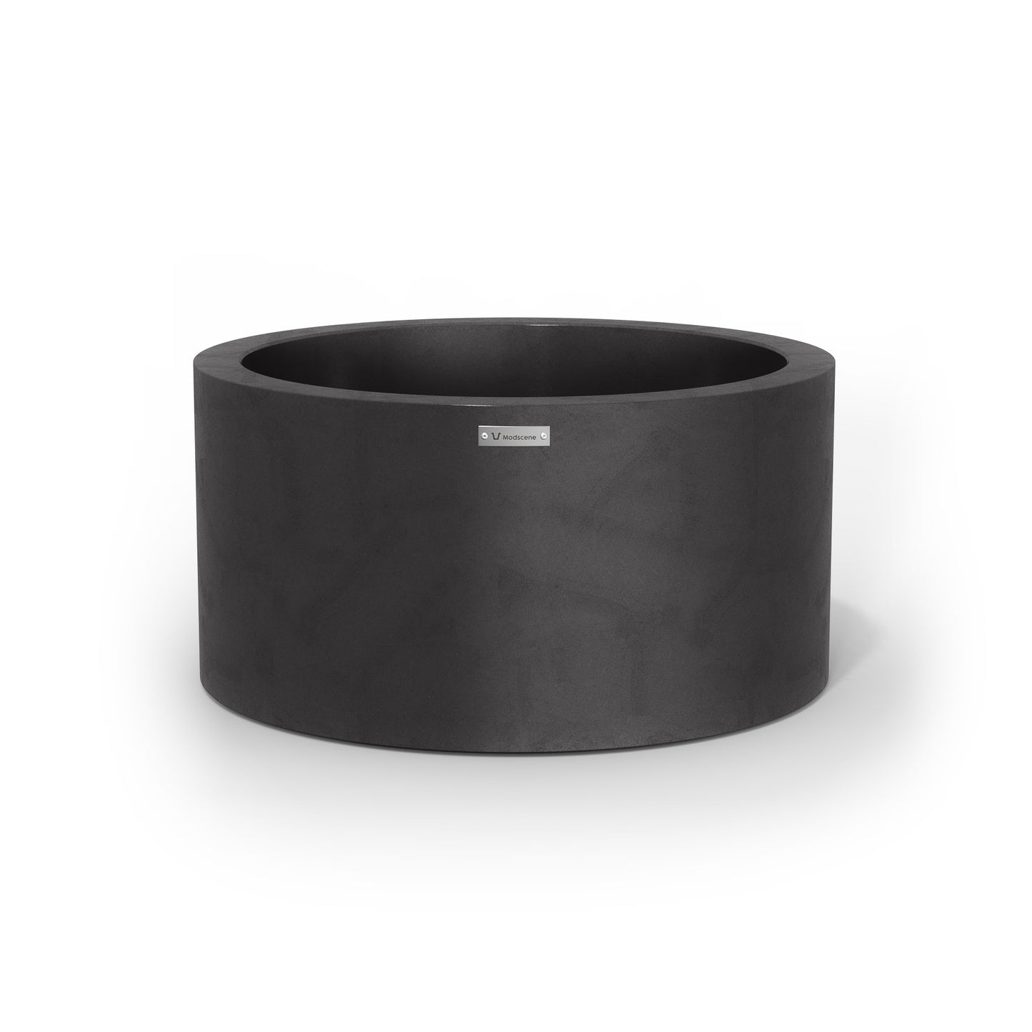 A medium cylinder shaped pot planter in matte black made by Modscene NZ.