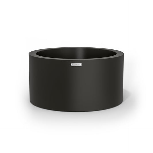 A cylinder shaped pot planter in black made by Modscene New Zealand.