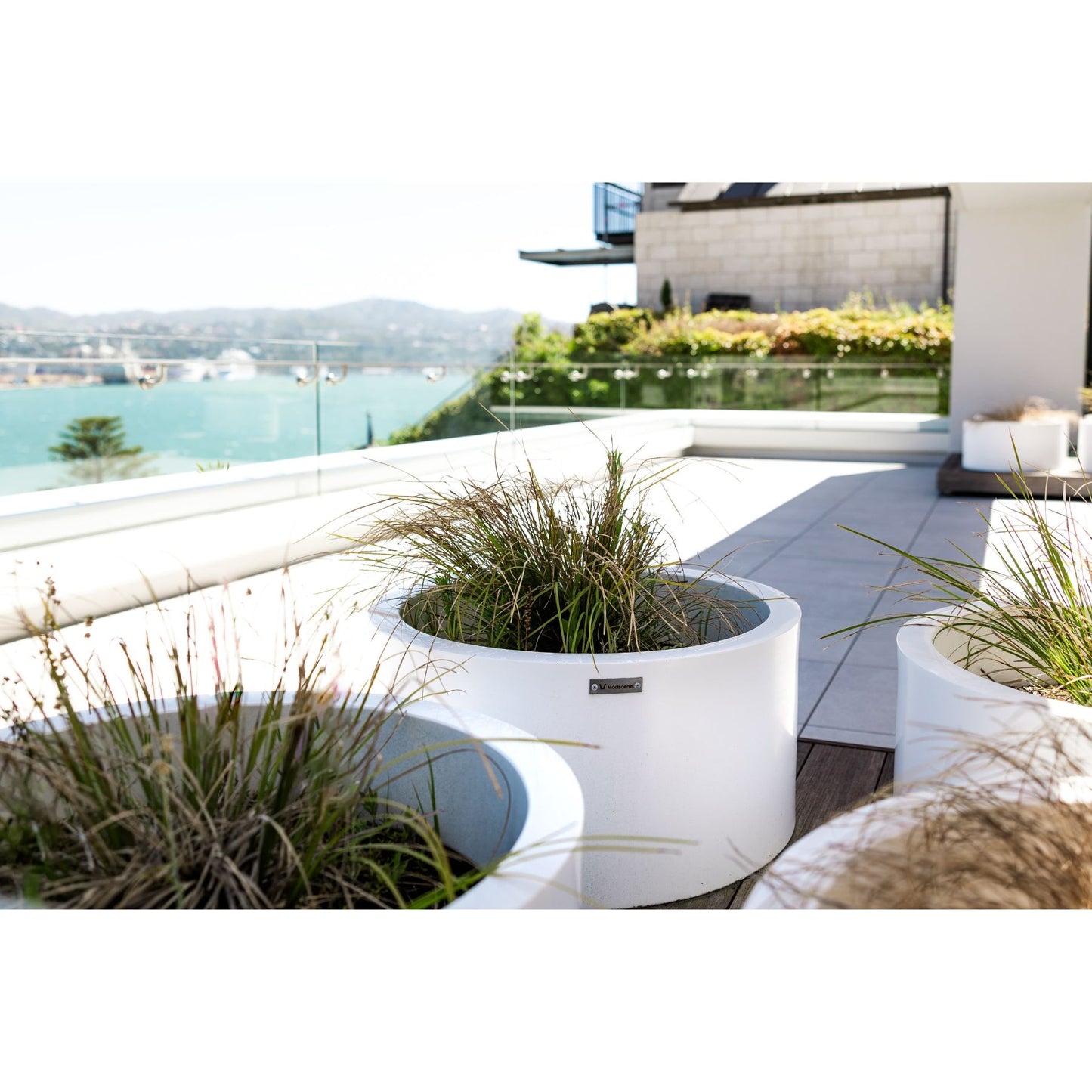 Stunning Modscene cylinder pot planters on a balcony.