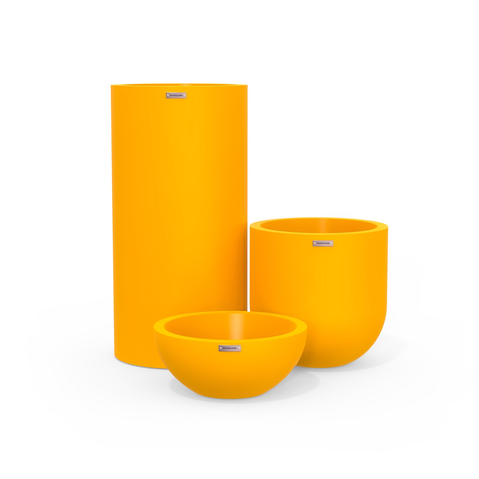 Cluster of three plastic plant pots in bright yellow. Round outdoor pots NZ.