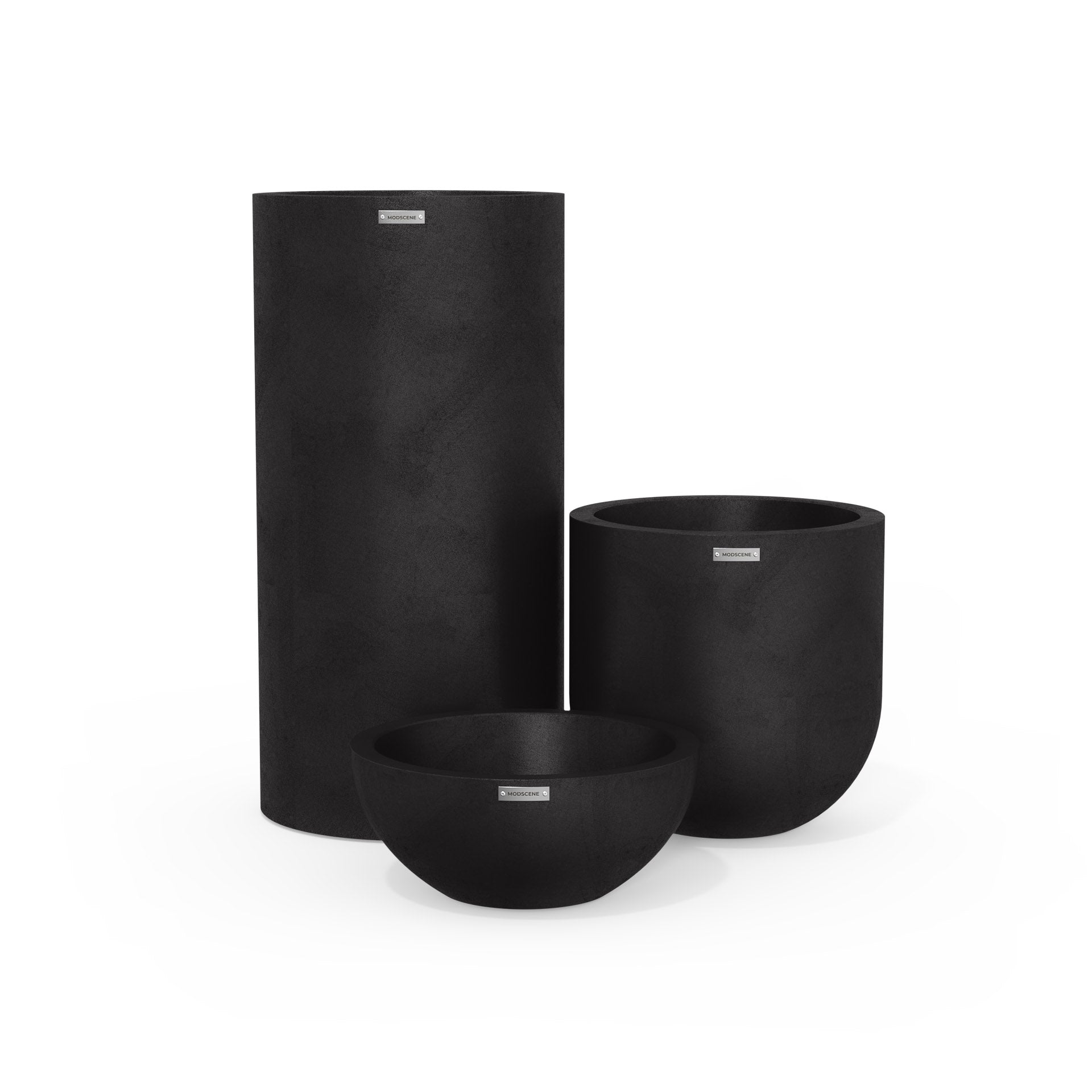 Cluster of three ceramic plant pots in matte black. Modern outdoor pots NZ.