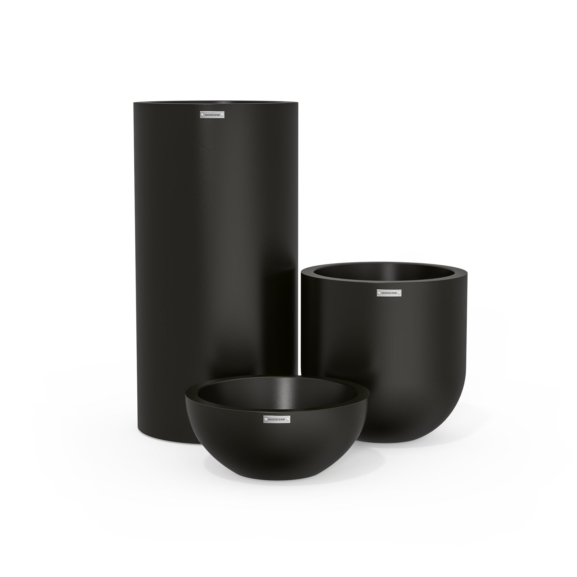 Cluster of three plastic plant pots. Black outdoor planters NZ.