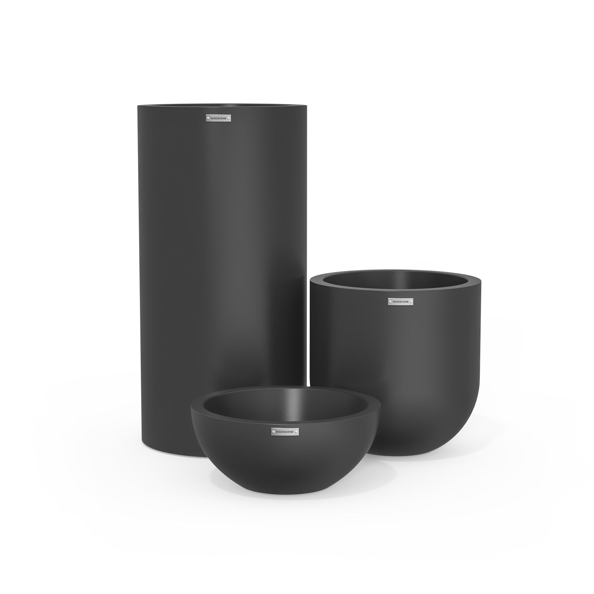 Cluster of three plastic plant pots in dark grey. Large outdoor pots.