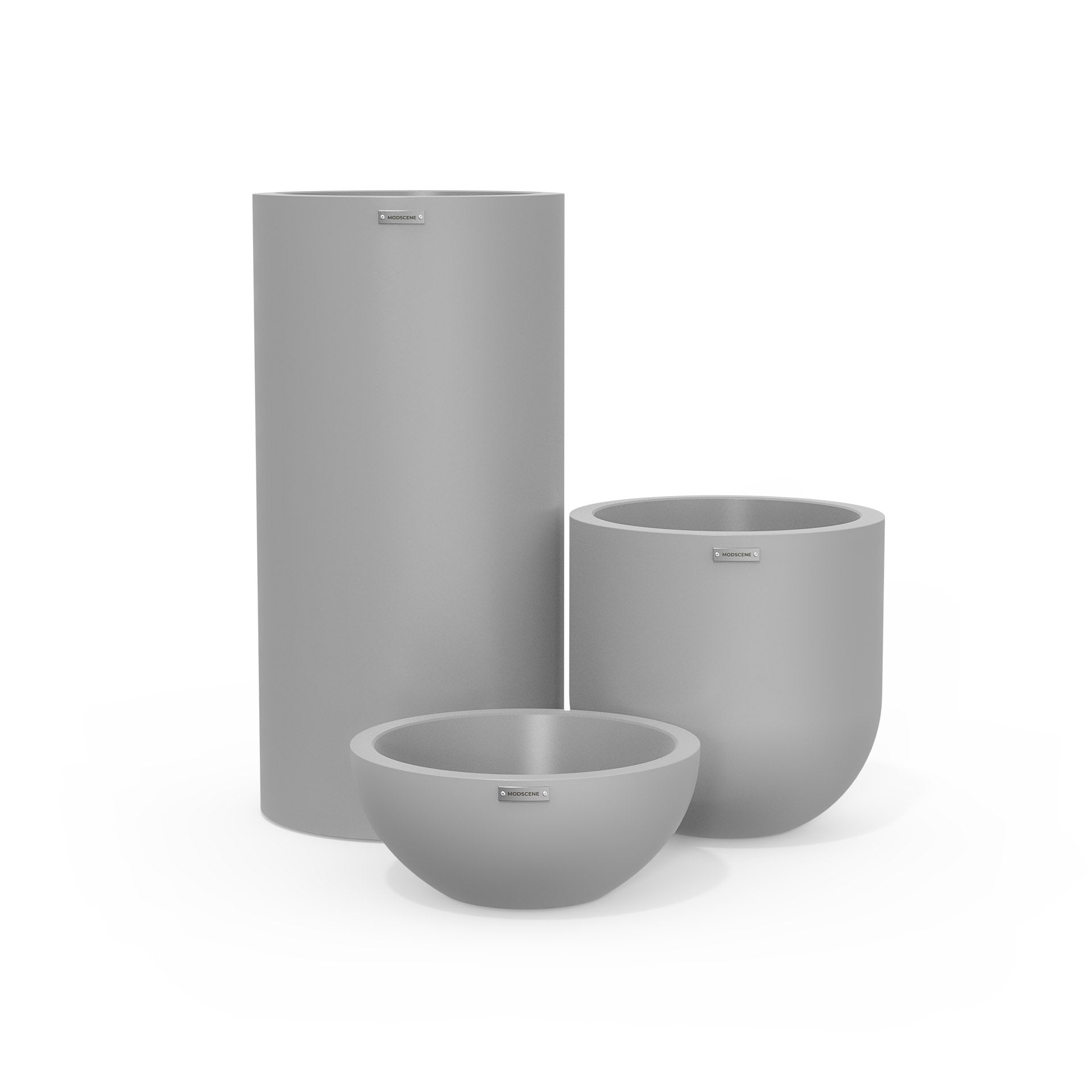Cluster of three outdoor plant pots in a light grey colour. Modscene outdoor planters NZ.
