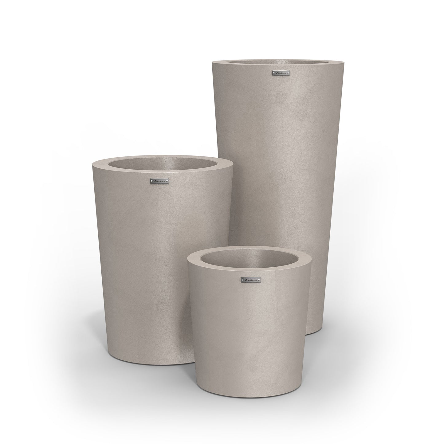 A cluster of three Modscene planter pots in a sand stone colour.