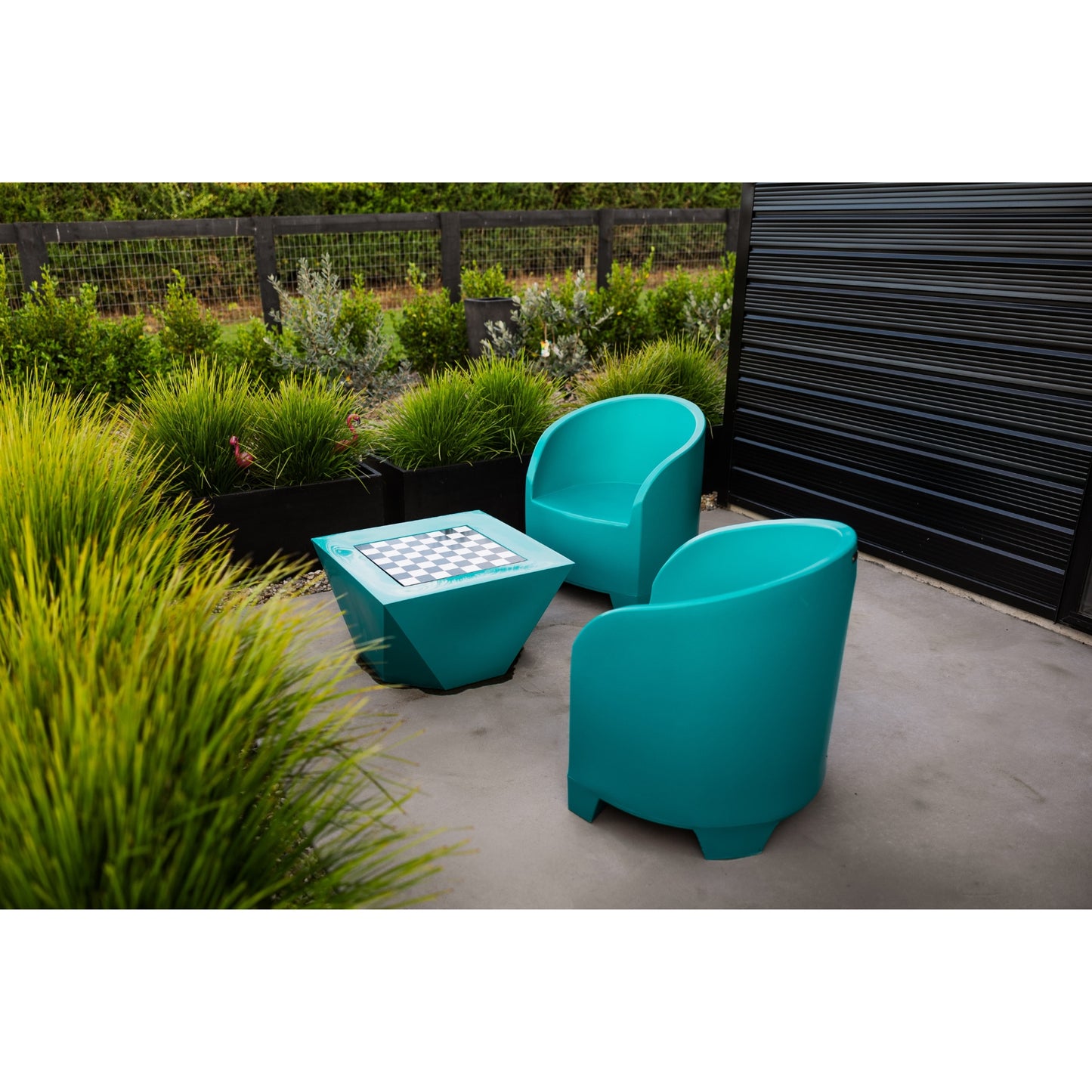 Modscene outdoor chairs and table in a teal blue colour.