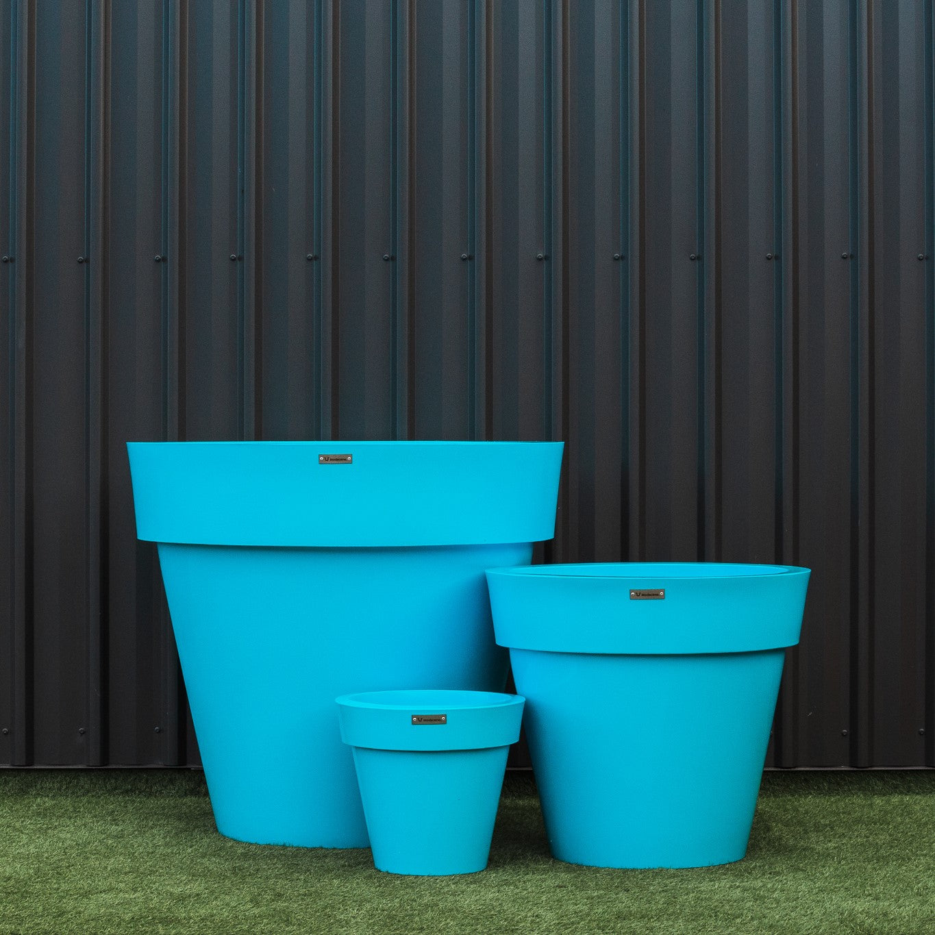 Blue planter cluster. Blue pot plants.