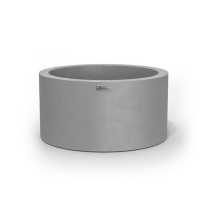 A medium cylinder shaped pot planter in a concrete grey colour.