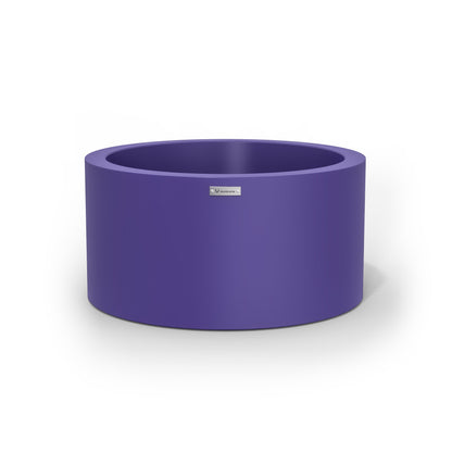 A cylinder shaped pot planter in a purple colour. Made in New Zealand.