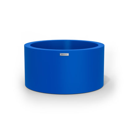 A cylinder shaped pot planter in a deep blue colour.