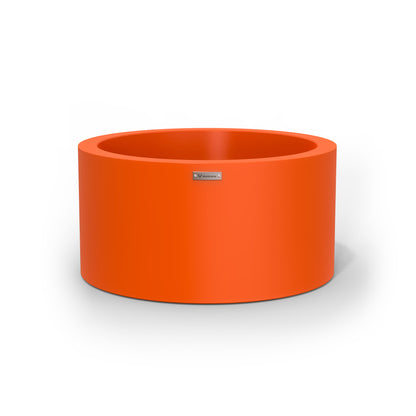 A cylinder shaped pot planter in orange made by Modscene NZ. 