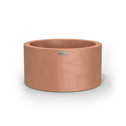 A rustic terracotta cylinder planter made by Modscene New Zealand