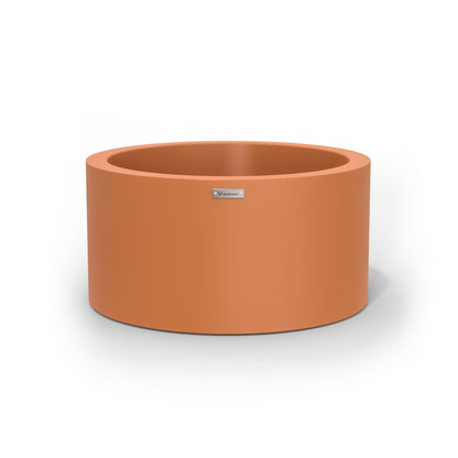 A cylinder shaped pot planter in terracotta made by Modscene New Zealand. 