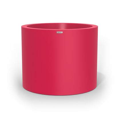 A giant cylinder pot planter in pink. Made by Modscene New Zealand.