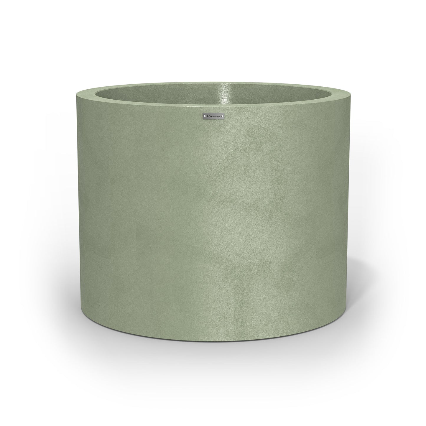 A giant cylinder pot planter in a pastel green colour with a concrete look finish.
