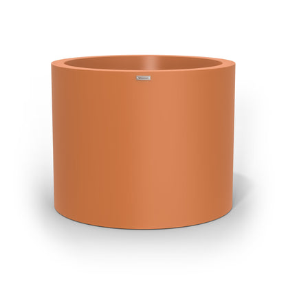 A giant cylinder pot planter in a terracotta colour. Made in NZ.