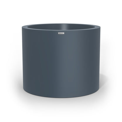 A giant cylinder pot planter in a storm blue colour. Made in NZ.