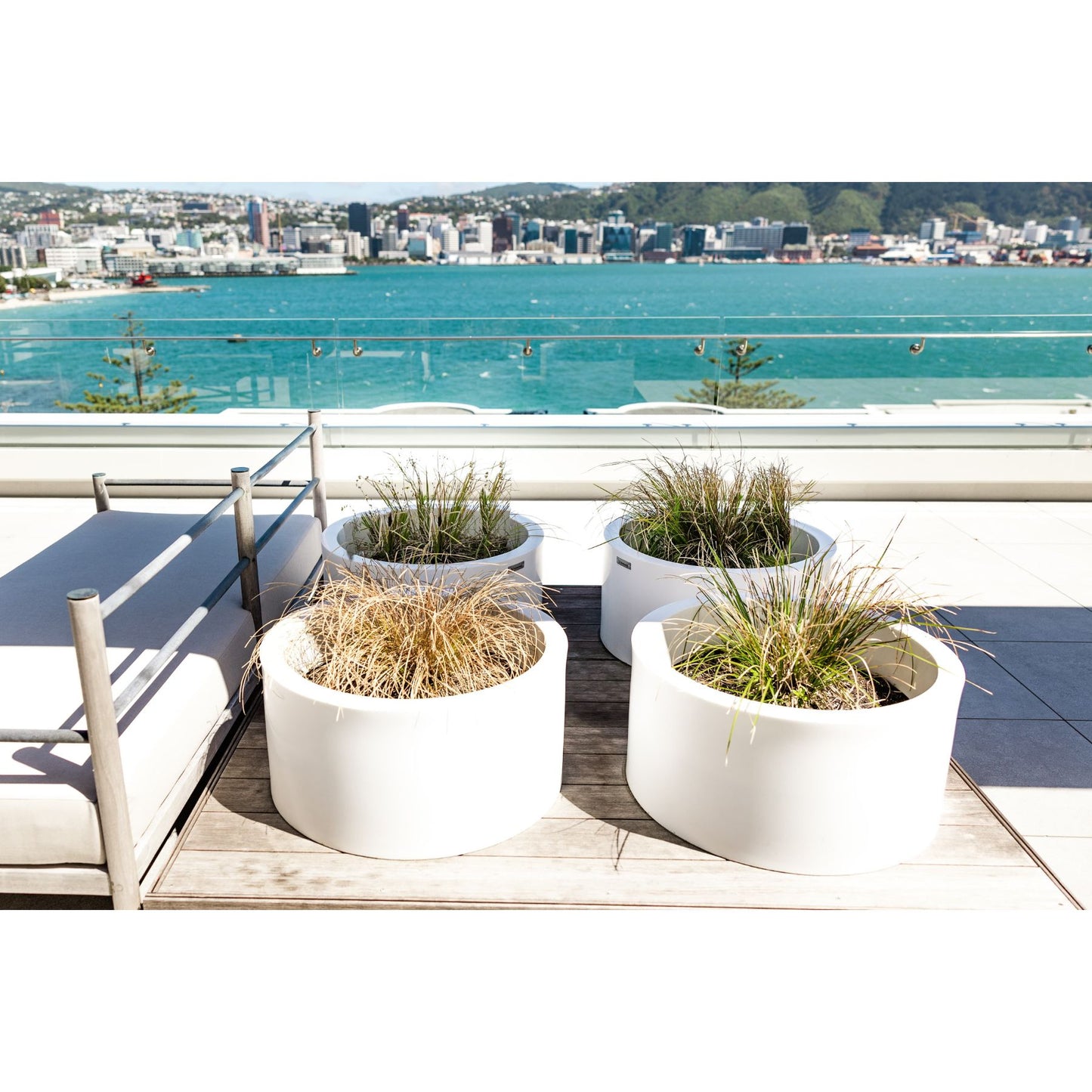 Modscene cylinder planter pots on a balcony.  