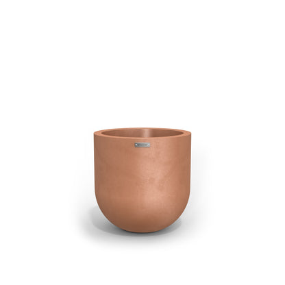 A small round pot made by Modscene in a rustic terracotta colour. NZ made planters.