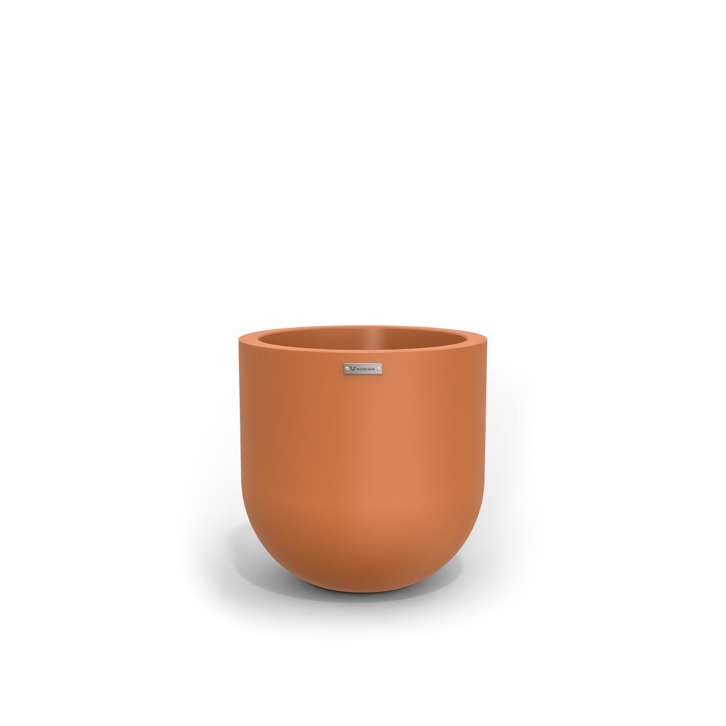 A small round pot made by Modscene in a terracotta colour. NZ made planters.