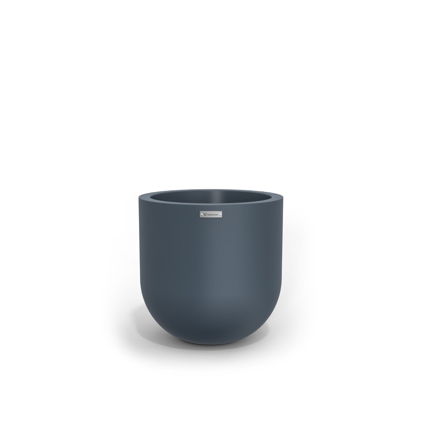 A small round planter in a dark blue made by Modscene. New Zealand made plant pots.