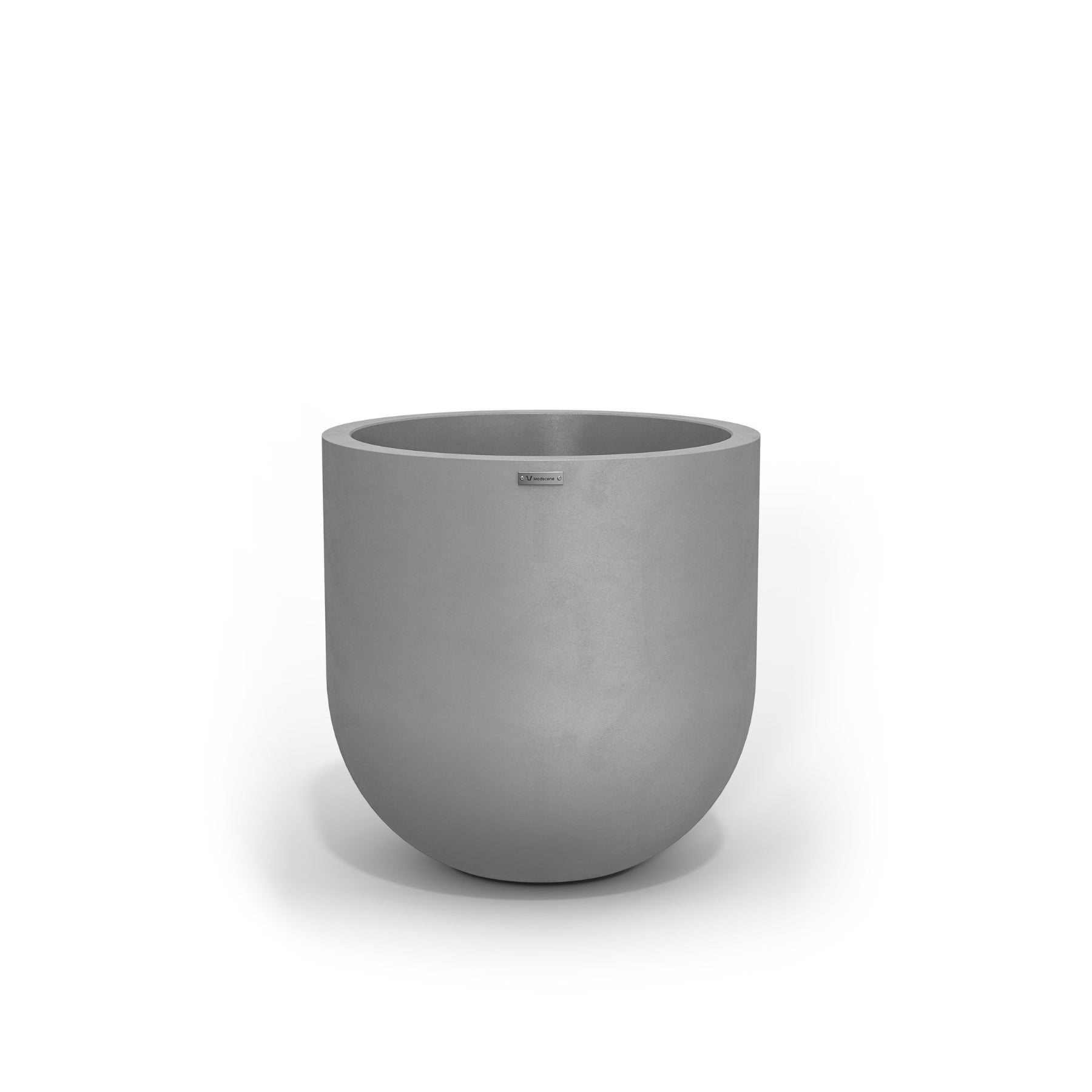 A large egg shaped pot by Modscene in a concrete grey colour. NZ made planters.