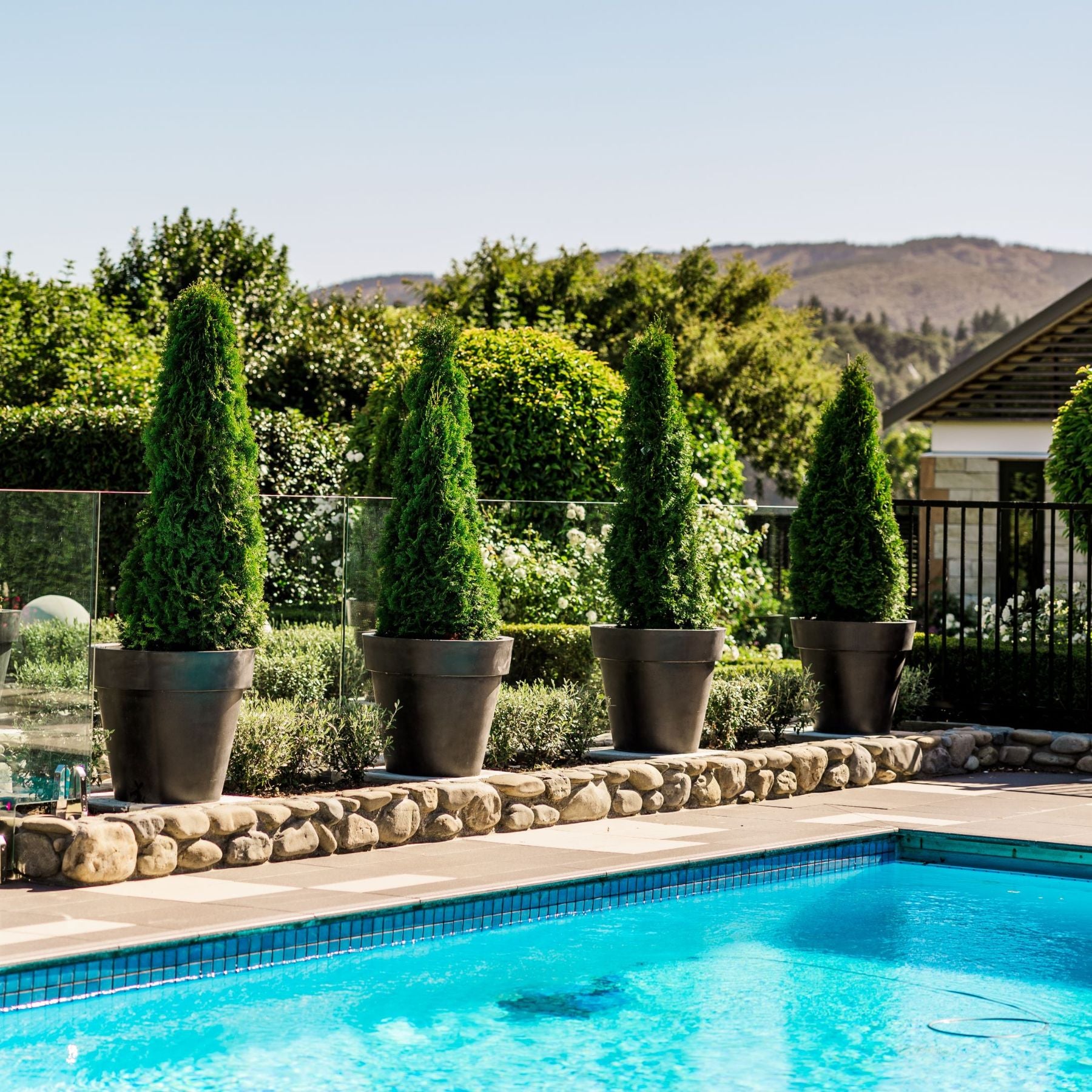 Madrid Planters by Modscene by a pool.