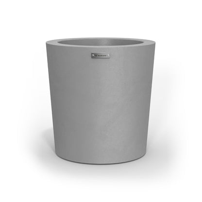 A modern style planter pot in a concrete grey colour.