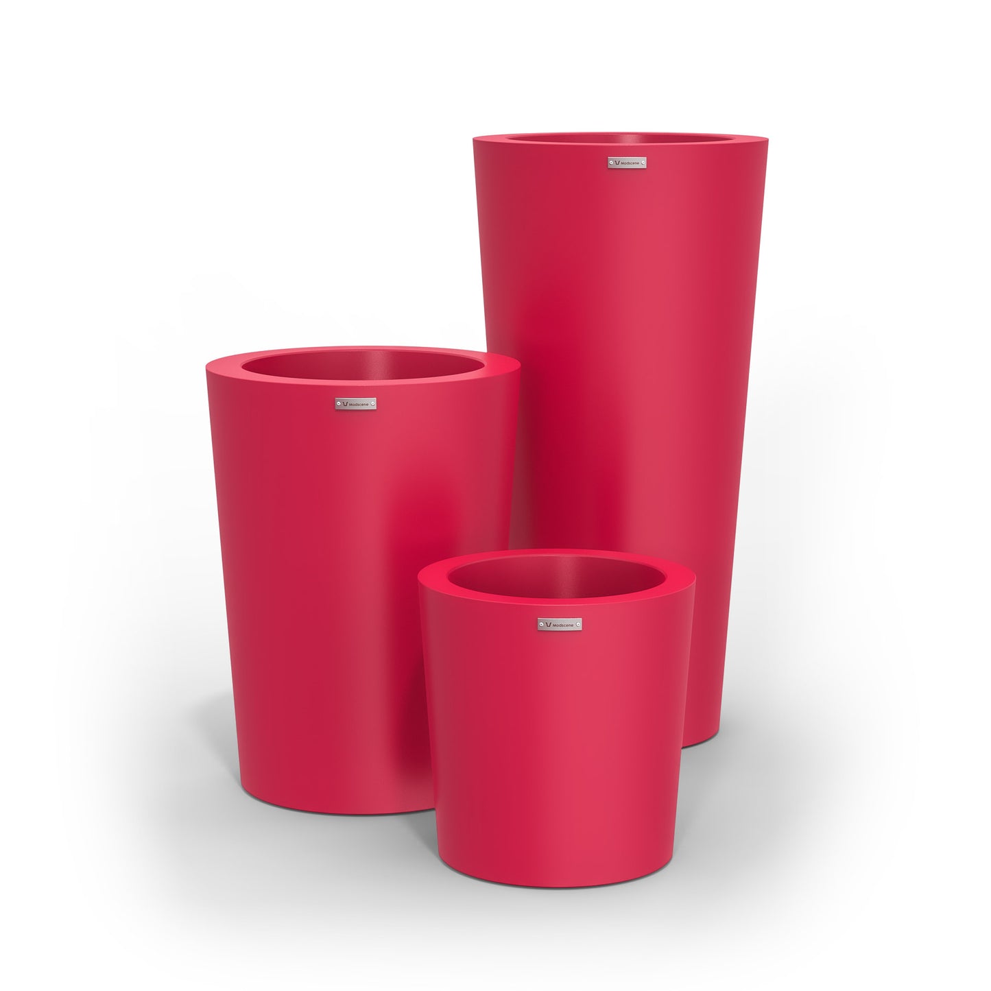 A cluster of three Modscene planter pots in pink. NZ made.