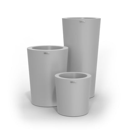 A cluster of three Modscene planter pots in a light grey colour.