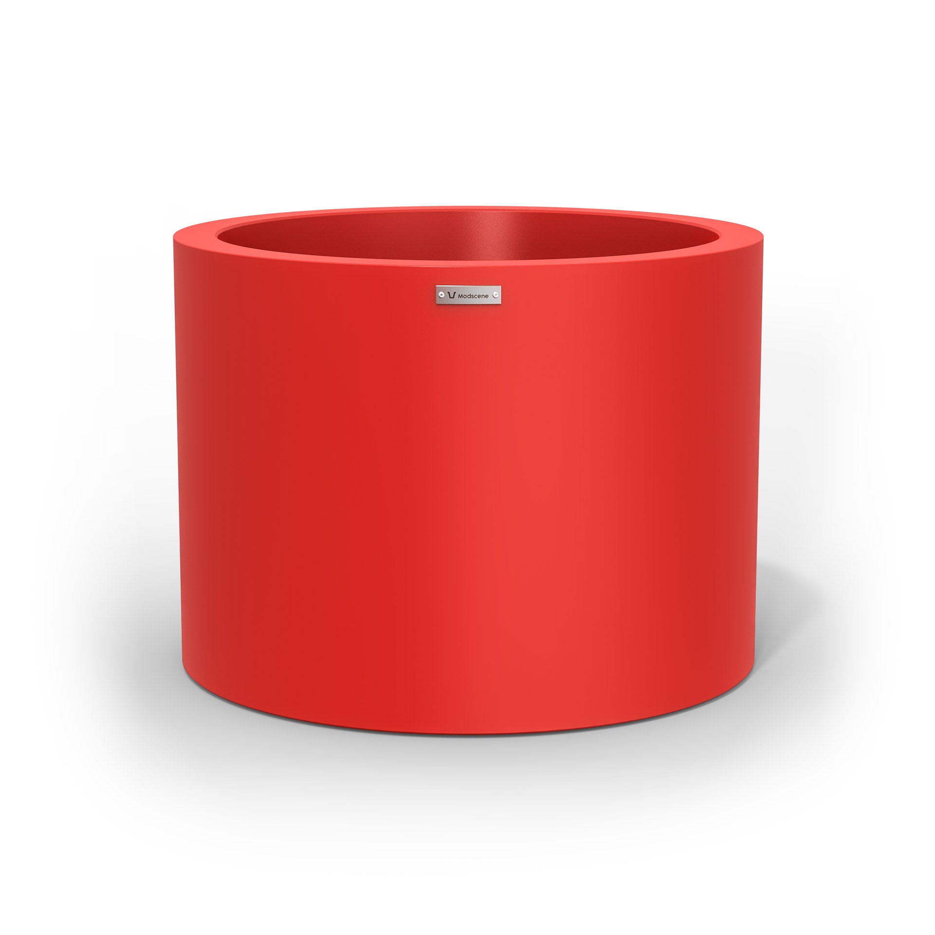 A cylinder shaped pot planter in red made by Modscene New Zealand. 