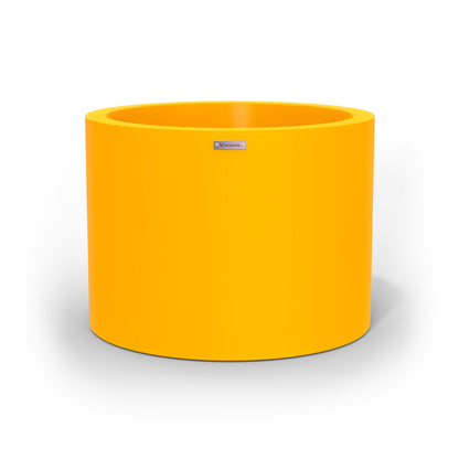 A cylinder shaped pot planter in yellow made by Modscene NZ. 