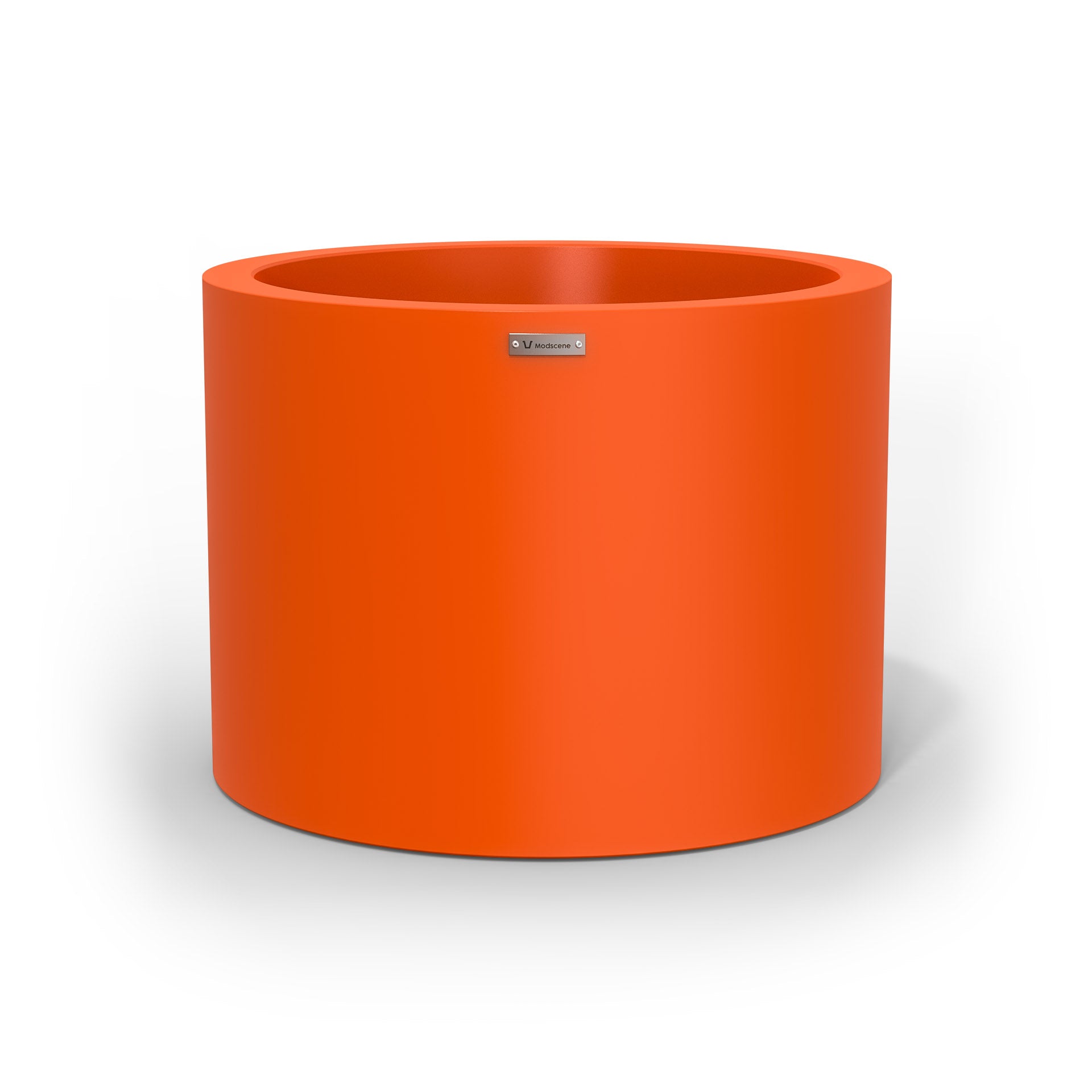A cylinder shaped pot planter in orange made by Modscene New Zealand. 