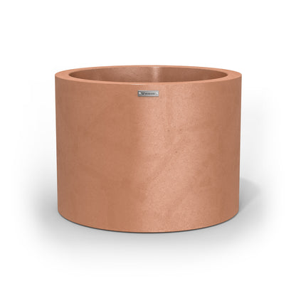 A cylinder shaped pot planter in a rustic terracotta colour.