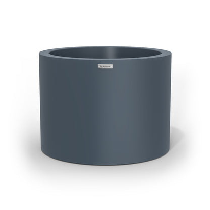 A cylinder shaped pot planter in a dark grey colour. NZ made.