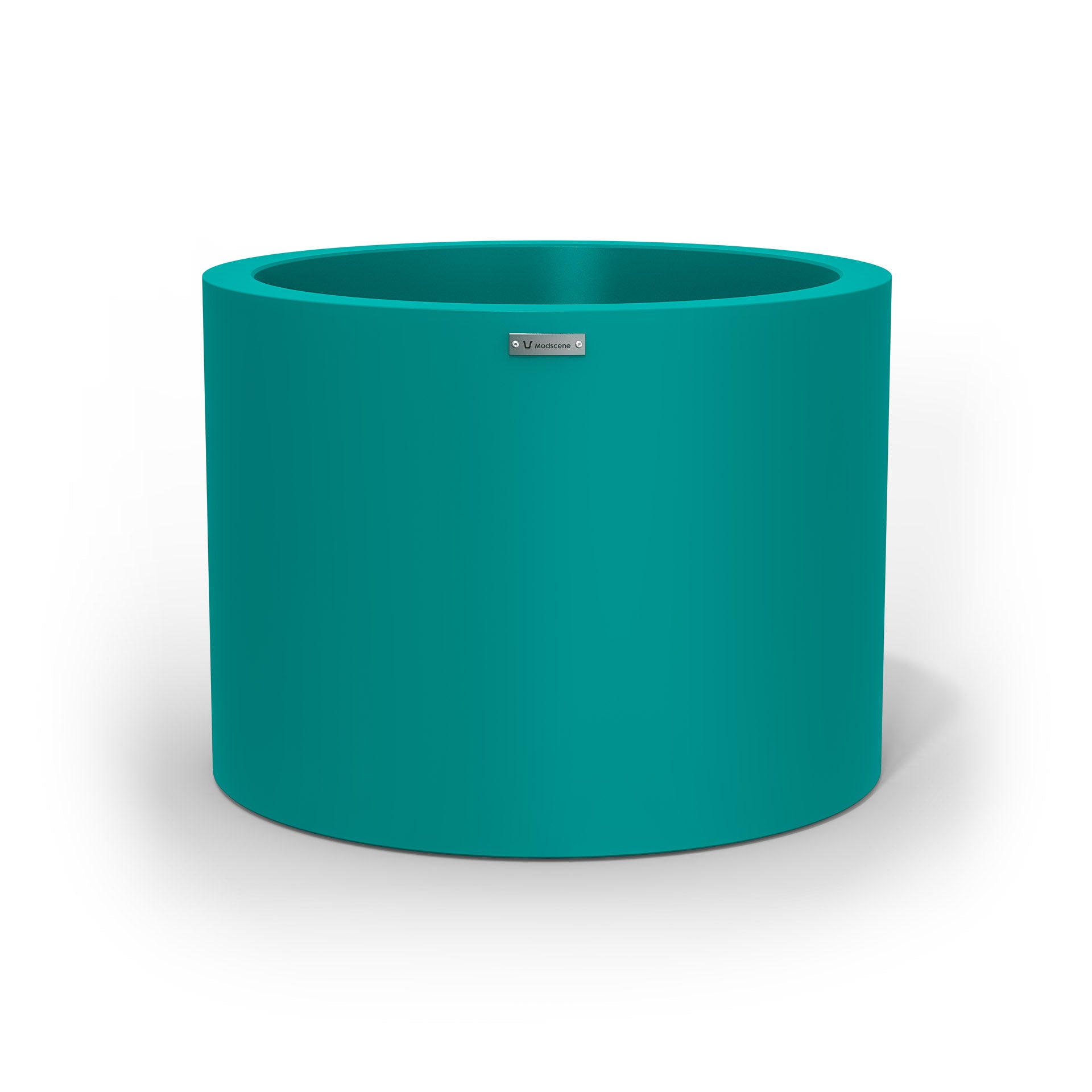 A cylinder shaped pot planter in teal made by Modscene NZ. 