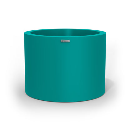 A cylinder shaped pot planter in teal made by Modscene NZ. 