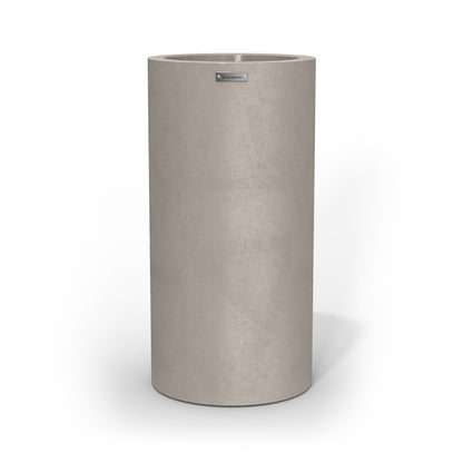 A large cigar cylinder pot planter in sand stone with a concrete look.