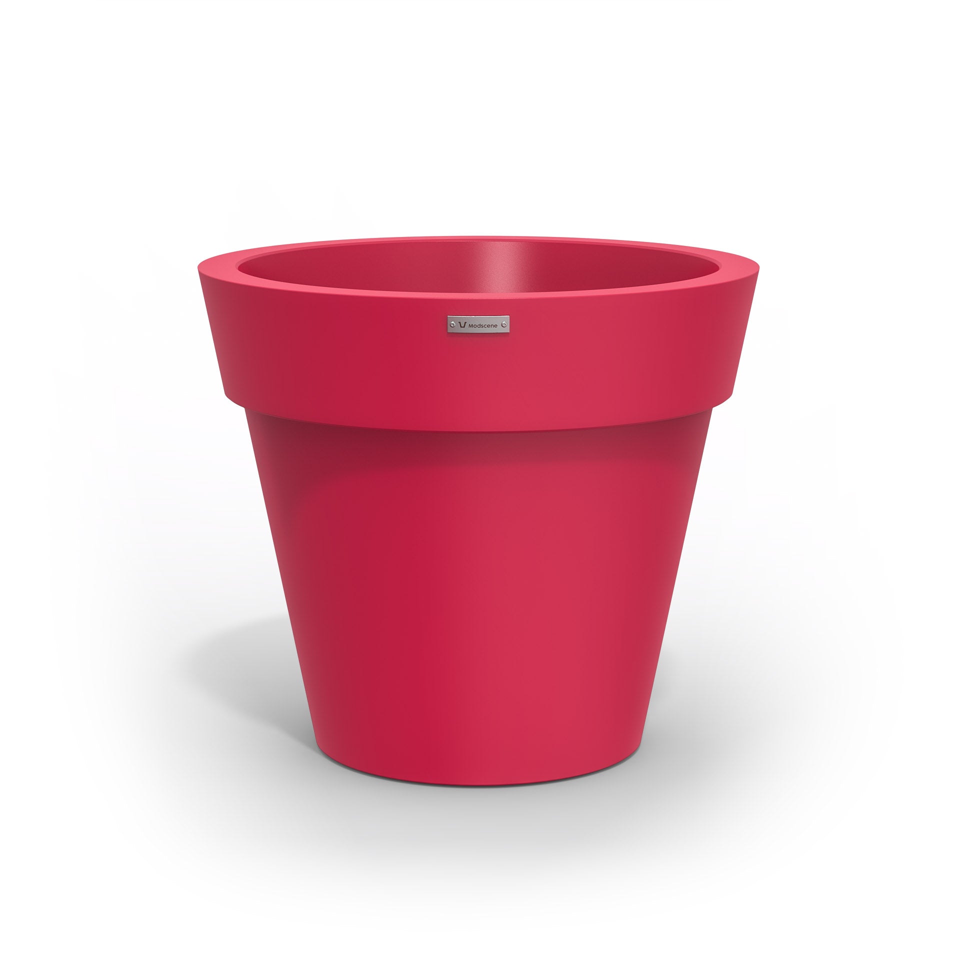 A pink Modscene plastic planter pot made in New Zealand.