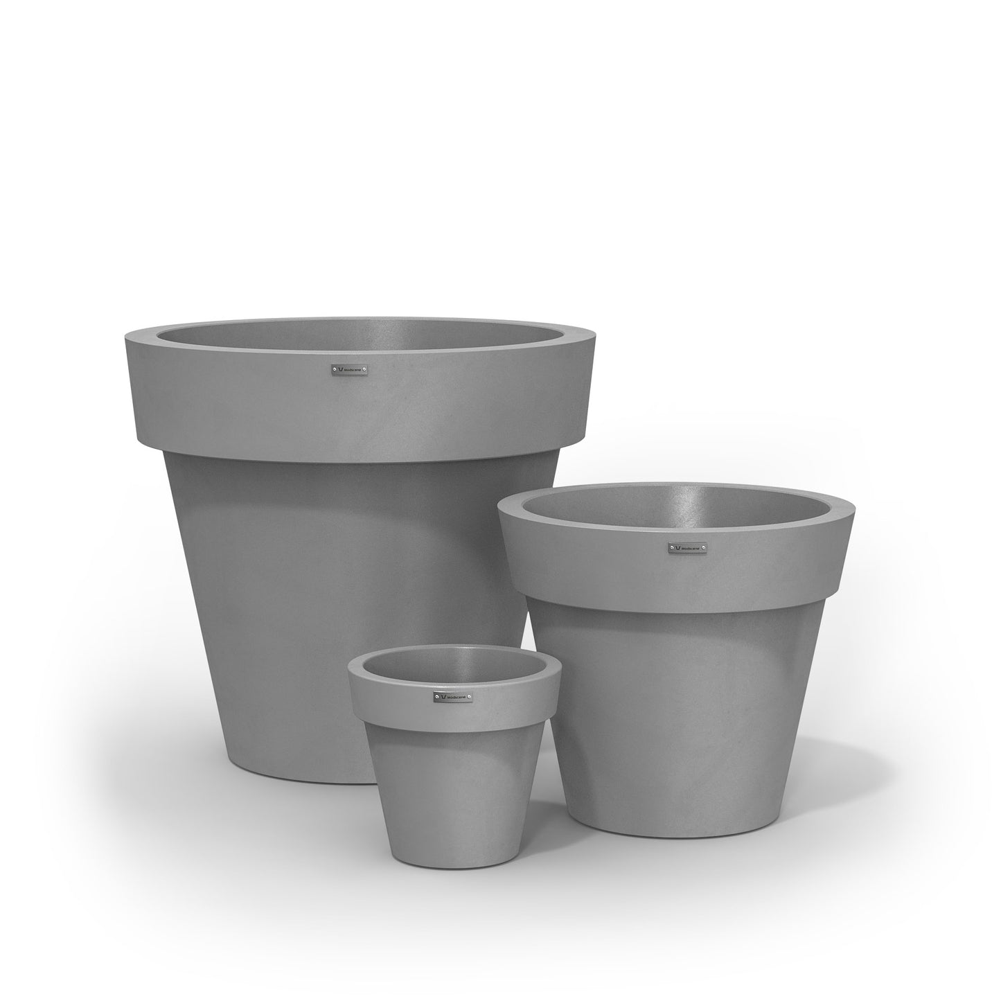 A cluster of three Modscene planters pots in a light grey colour with a concrete look.