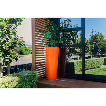 A large orange Modscene planter pot on a balcony.