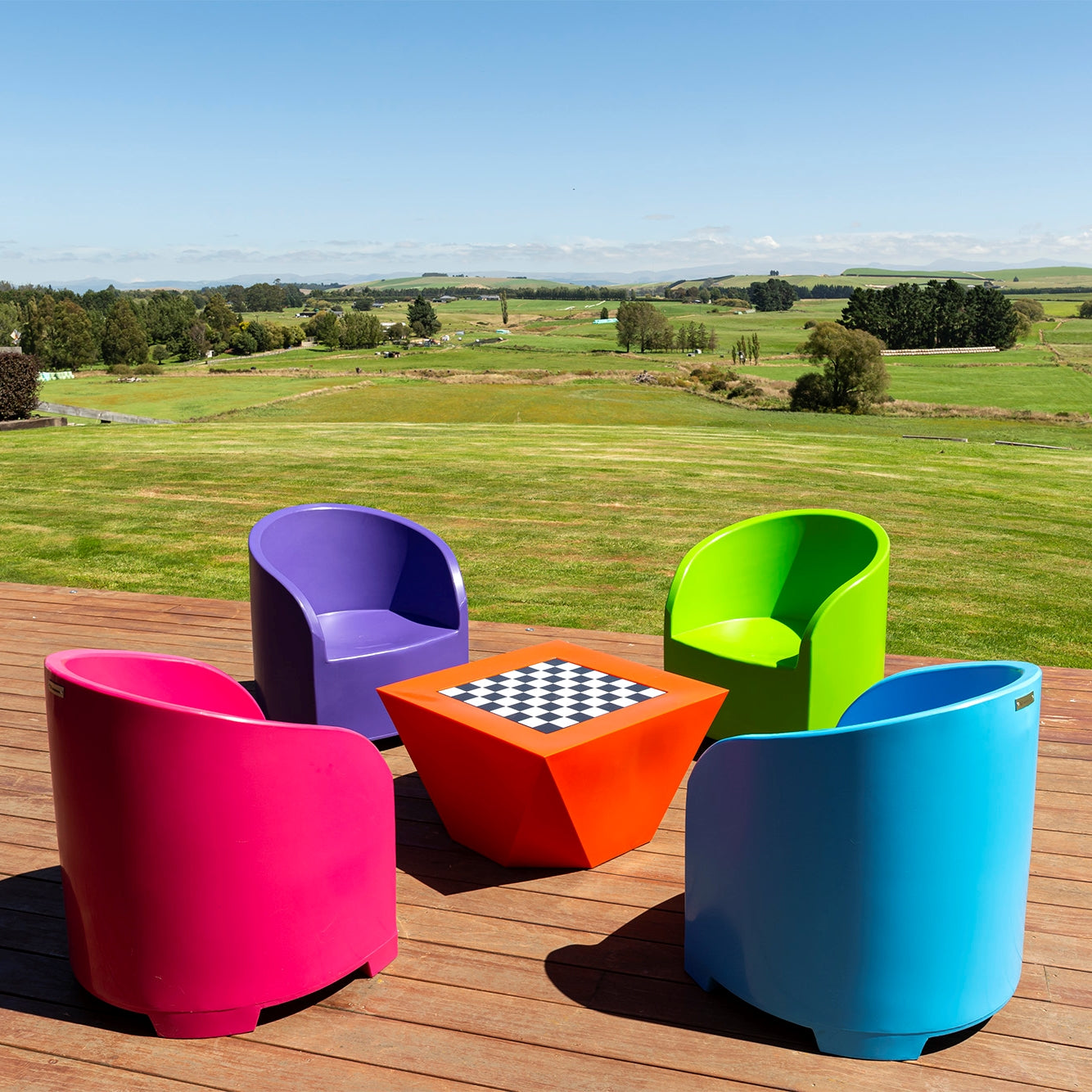 Bright Modscene outdoor furniture on a deck. Colourful outdoor furniture NZ.