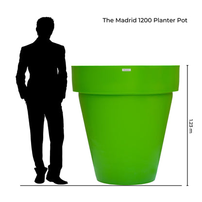 This photo illustrates how large the Madrid 1200 planter is beside a person. Giant planter pots New Zealand.