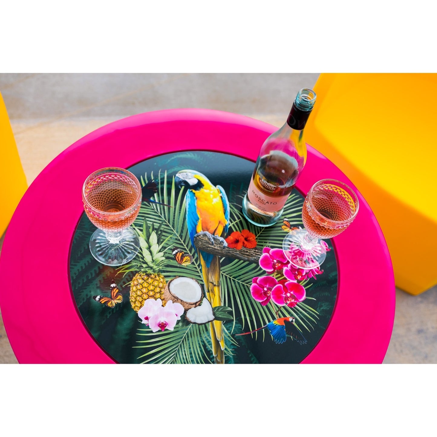 Bright yellow and pink Modscene outdoor furniture on a patio. Outdoor furniture New Zealand.